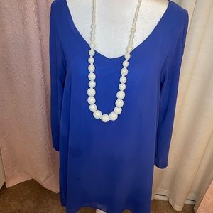 Women’s shirt dress and necklace